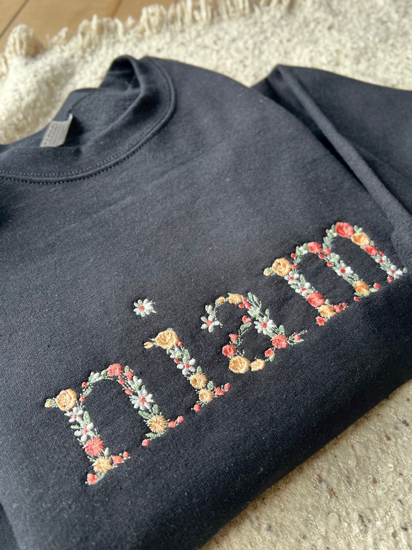 Floral Niam/Nam Black Sweater